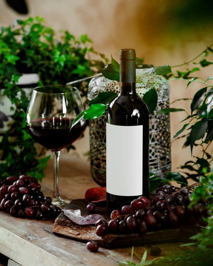 glass-red-wine-bottle-red-wine-table-with-red-grapes